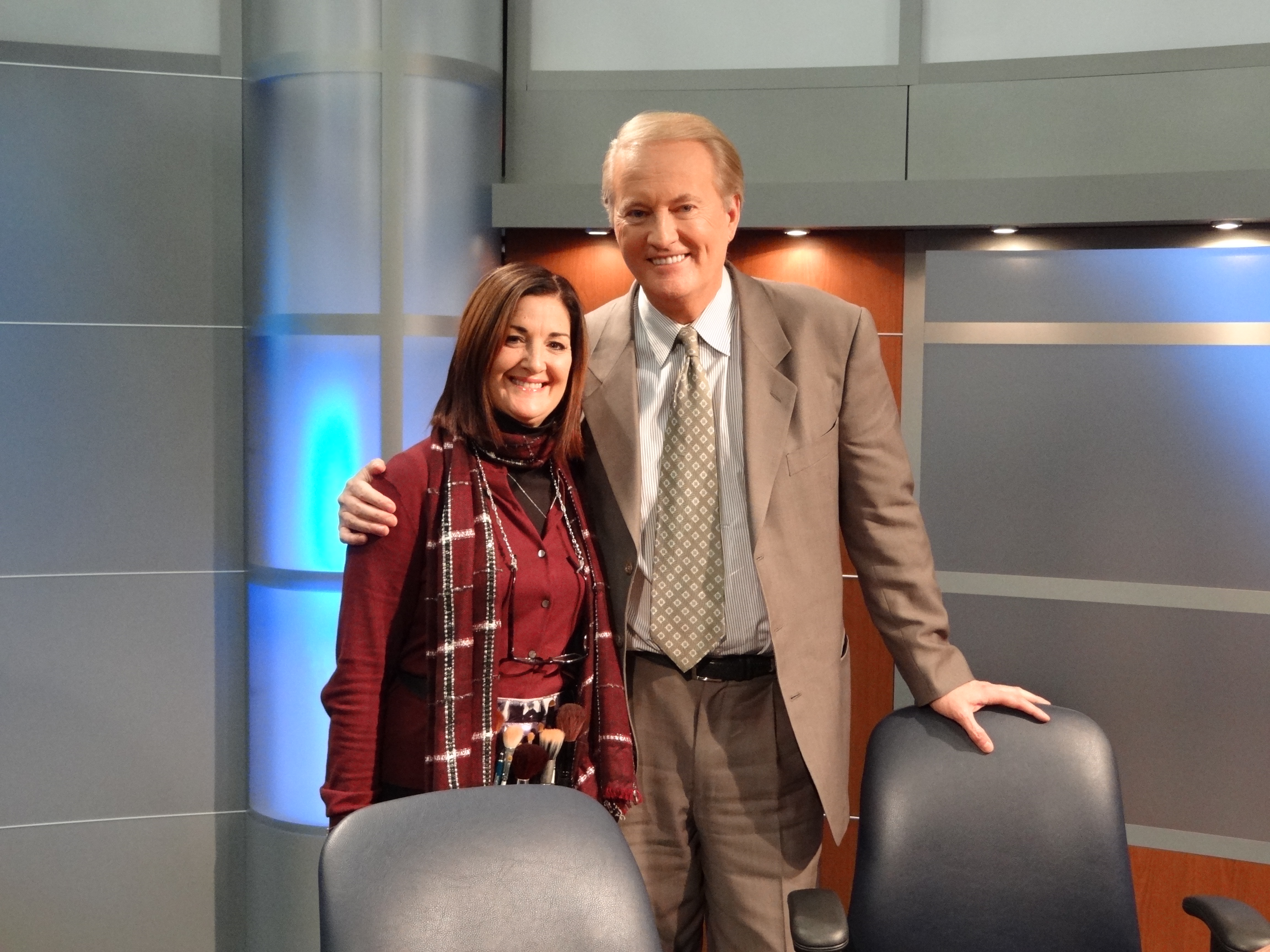 Holland on set with talk show host Larry Mendte
